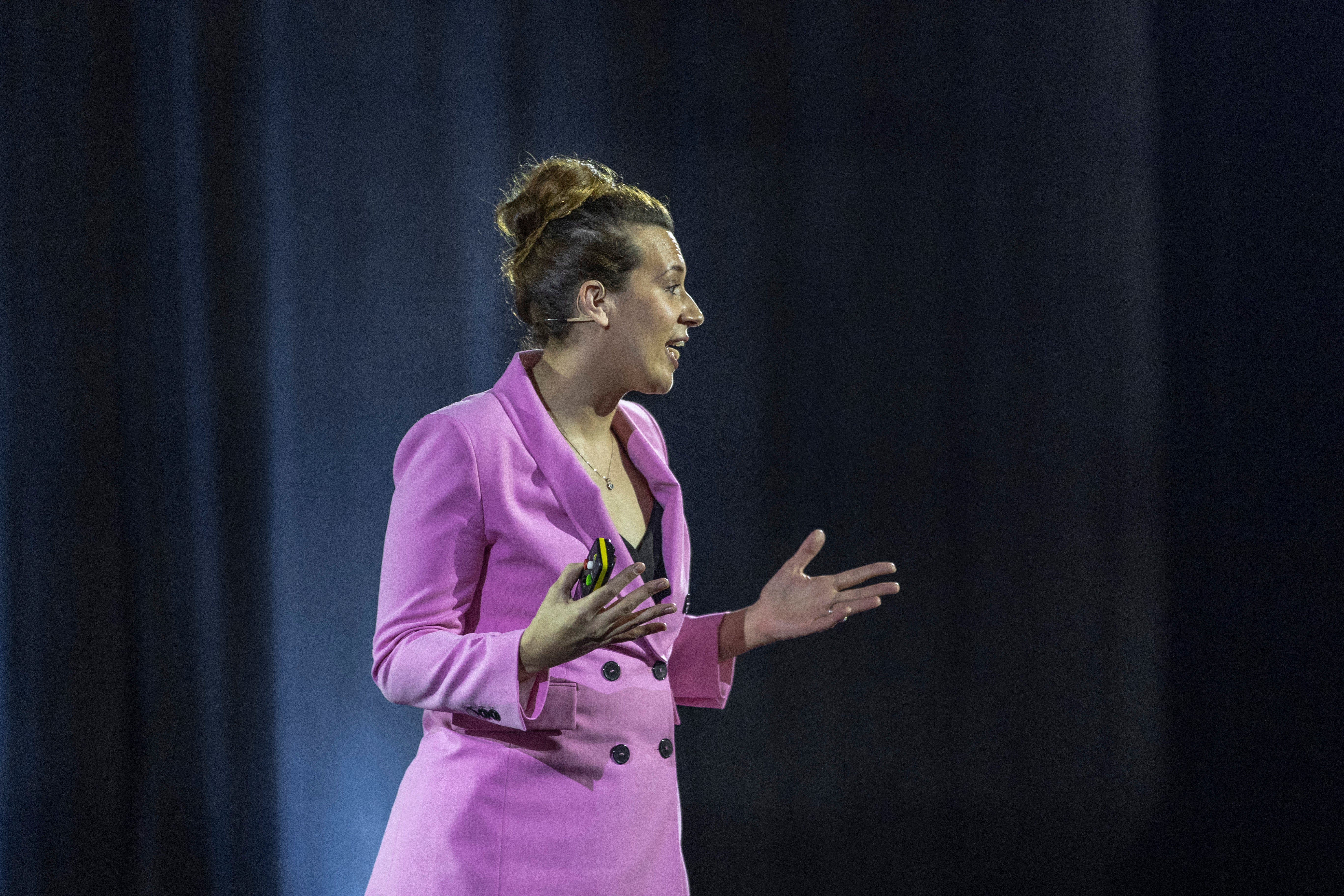 Businesswoman presenting at a conference.