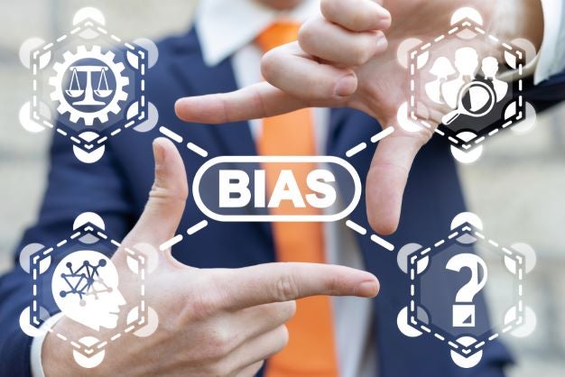 men's suit with fingers showing with the word "bias" in front, as tho manipulating different aspects of bias in 4 icons: scales of justice, people, inner workings of brain, questions