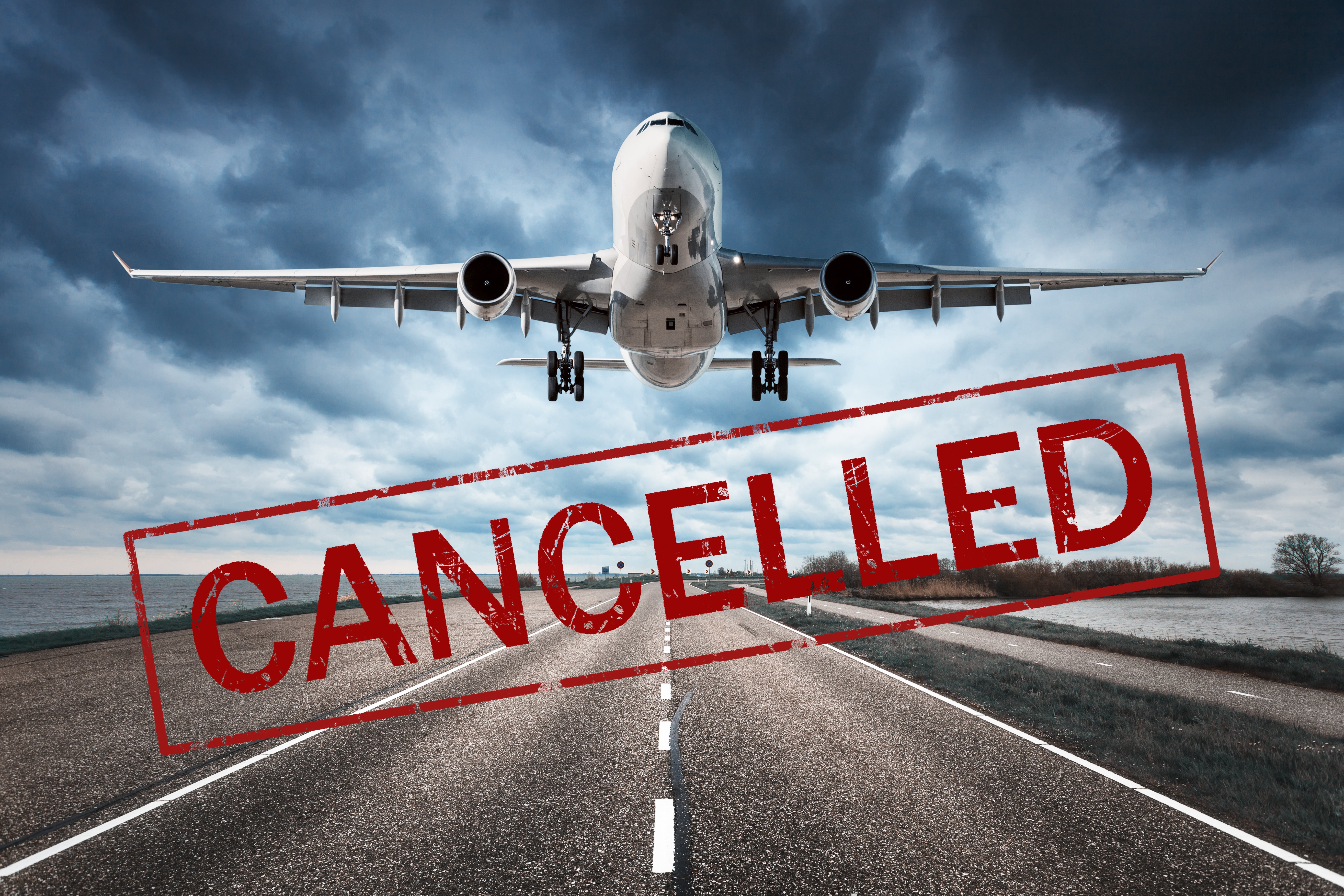 Photo of airplane taking off on runway with the word, "cancelled" stamped across it in red.