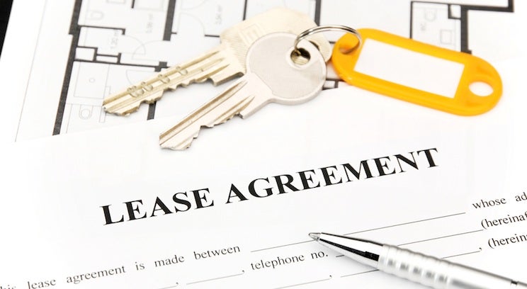 keys on top of a lease agreement