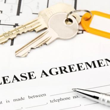 keys on top of a lease agreement