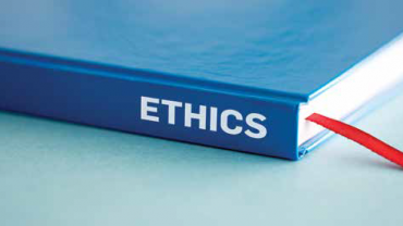 the word ethics on the spine of a book
