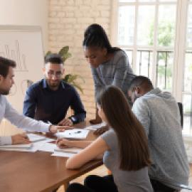 Volunteer workers around a table