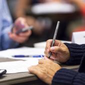Woman signing document