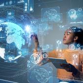 African American businesswoman using virtual technology of a blue globe and tech interface.