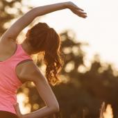 a woman stretching in work out clothes