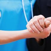nurse and colleague shaking hands