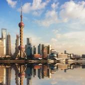 Shanghai's city skyline with multiple buildings on the water