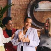 Business women laughing together