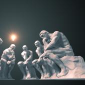 A series of Thinker-like statues with lightbulb alit above one