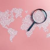 magnifying glass on world map
